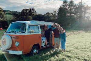 Family with VW camper van