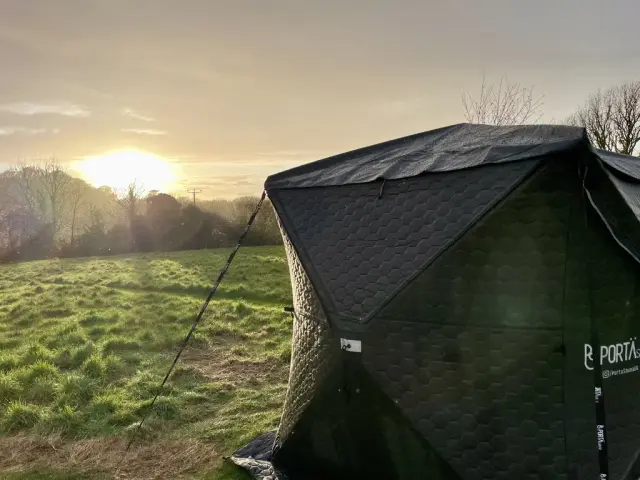 Wood-fired sauna at dawn