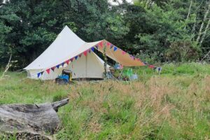 Bell tent with bunting in summer